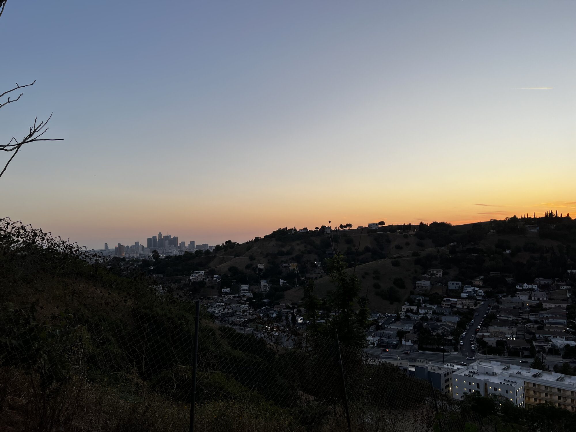 Dusk over the El Sereno hills with the downtown Los Angeles skyline in the distance.